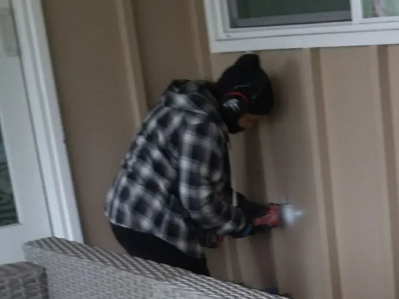 Professional electrician installing an exterior outlet in Bothell